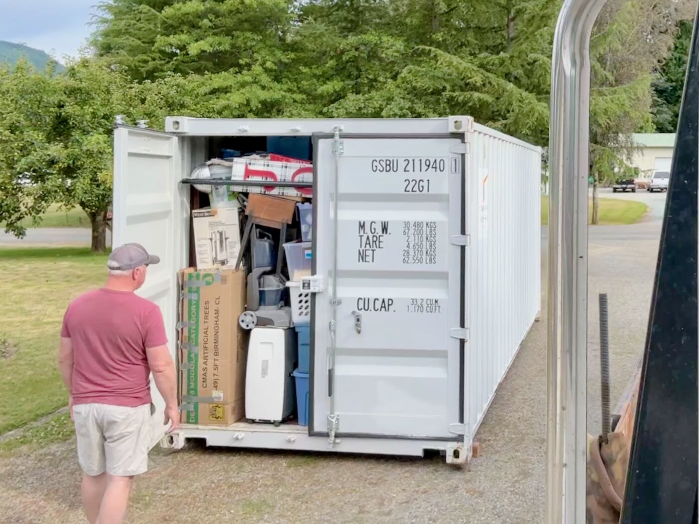 Man loading moving boxes into a portable storage unit in Melbourne