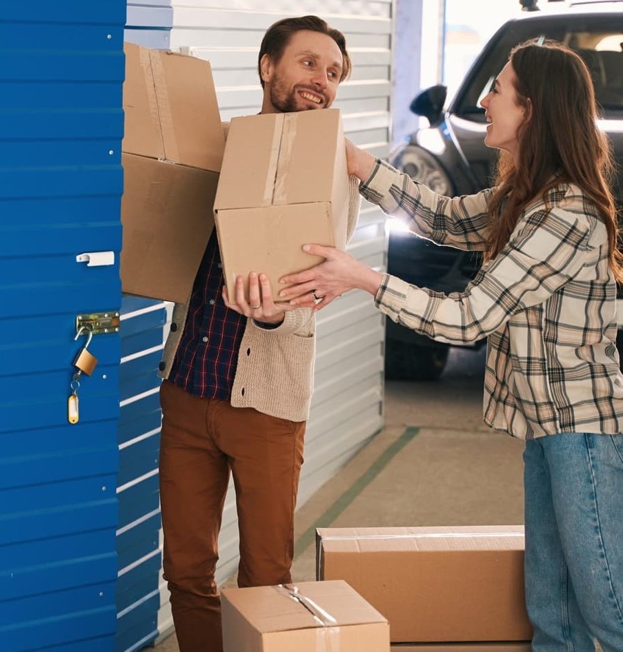 People carrying boxes into a self storage unit in Melbourne